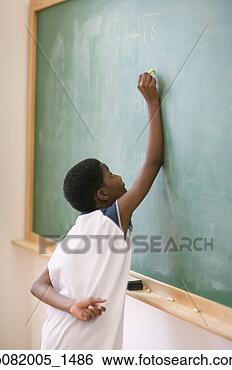 Stock Photo - side view of boy 
writing on chalkboard. 
fotosearch - search 
stock photos, 
pictures, images, 
and photo clipart