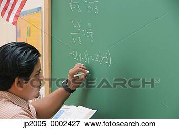 Picture - teacher doing 
mathematics on 
the chalkboard. 
fotosearch - search 
stock photos, 
pictures, images, 
and photo clipart