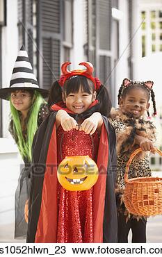 Stock Photo - three girls dressed 
up for halloween. 
fotosearch - search 
stock photos, 
pictures, images, 
and photo clipart