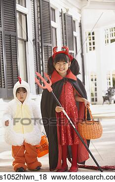 Stock Photo - two girls dressed 
in costume for 
halloween. fotosearch 
- search stock 
photos, pictures, 
images, and photo 
clipart