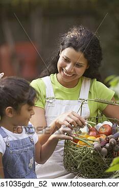 Stock Photo - woman and girl 
with basket of 
produce. fotosearch 
- search stock 
photos, pictures, 
images, and photo 
clipart