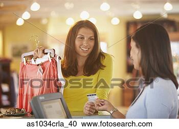 Stock Photography - woman purchasing 
clothing. fotosearch 
- search stock 
photos, pictures, 
images, and photo 
clipart