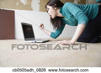 Stock Photo - woman yelling 
at laptop screen. 
fotosearch - search 
stock photos, 
pictures, images, 
and photo clipart