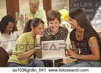 Stock Photography - women looking 
at laptop computer. 
fotosearch - search 
stock photos, 
pictures, images, 
and photo clipart