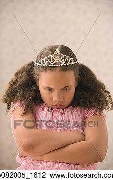 Stock Photo - young girl pouting 
with princess 
crown. fotosearch 
- search stock 
photos, pictures, 
images, and photo 
clipart