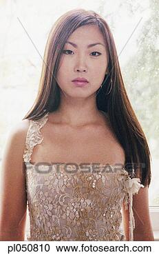 Stock Photography - young woman posing 
for the camera 
in an evening 
gown. fotosearch 
- search stock 
photos, pictures, 
images, and photo 
clipart