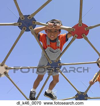 Stock Photography - young boy playing 
on a play structure. 
fotosearch - search 
stock photos, 
pictures, images, 
and photo clipart