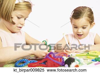 Stock Image - young girls doing 
arts and crafts. 
fotosearch - search 
stock photos, 
pictures, images, 
and photo clipart