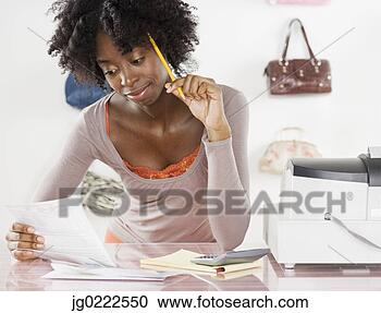 Stock Photography - female employee 
working behind 
the counter. fotosearch 
- search stock 
photos, pictures, 
images, and photo 
clipart