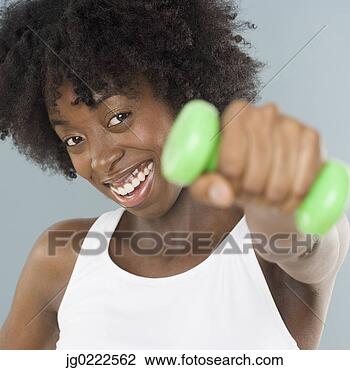 Banco de Imagem - jovem,  mulher, 
 levantamento, 
 pesos. fotosearch 
- busca de fotos, 
imagens e clipart