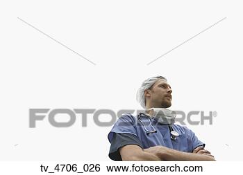 Stock Photo - male surgeon standing 
with arms crossed. 
fotosearch - search 
stock photos, 
pictures, images, 
and photo clipart