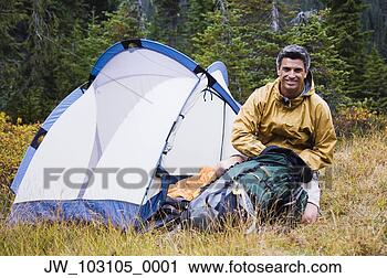 Stock Photography - man camping in 
forested area. 
fotosearch - search 
stock photos, 
pictures, images, 
and photo clipart