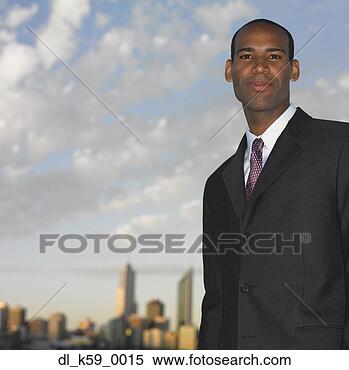 Stock Image - african businessman 
with urban skyline 
in background, 
perth, australia. 
fotosearch - search 
stock photos, 
pictures, images, 
and photo clipart