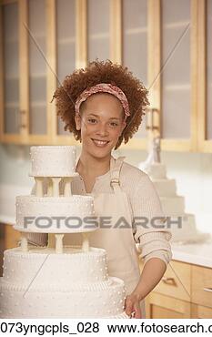 Stock Photo - african female 
baker next to 
a wedding cake, 
 richmond,  virginia. 
fotosearch - search 
stock photos, 
pictures, images, 
and photo clipart