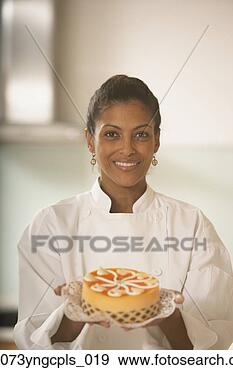 Stock Photograph - african female 
pastry chef holding 
a cake,  richmond, 
 virginia. fotosearch 
- search stock 
photos, pictures, 
images, and photo 
clipart