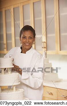 Stock Photo - african female 
pastry chef next 
to a wedding cake, 
 richmond. fotosearch 
- search stock 
photos, pictures, 
images, and photo 
clipart