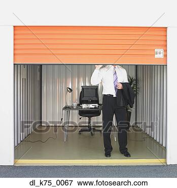 Picture - businessman closing 
door of storage 
unit office. fotosearch 
- search stock 
photos, pictures, 
images, and photo 
clipart