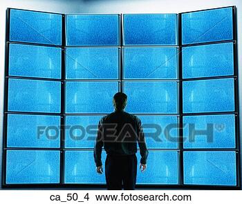 Stock Photo - businessman standing 
in front of blank 
television screens. 
fotosearch - search 
stock photos, 
pictures, images, 
and photo clipart