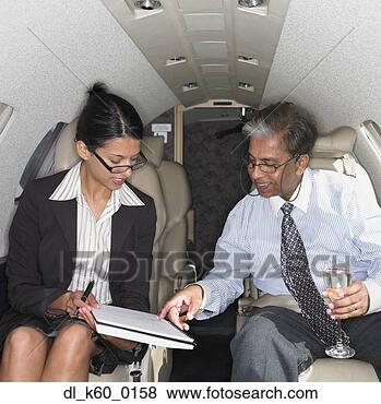 Stock Photo - businesswoman 
and businessman 
inside airplane, 
perth, australia. 
fotosearch - search 
stock photos, 
pictures, images, 
and photo clipart