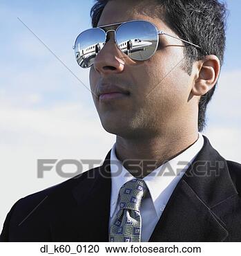 Stock Photography - close up of indian 
businessman with 
mirrored sunglasses, 
 perth. fotosearch 
- search stock 
photos, pictures, 
images, and photo 
clipart