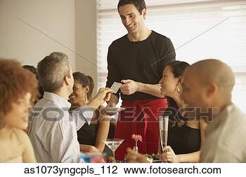 Stock Photo - couple paying 
bill at restaurant, 
richmond, virginia, 
united states. 
fotosearch - search 
stock photos, 
pictures, images, 
and photo clipart