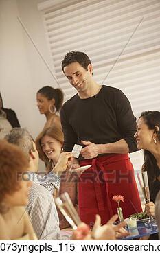 Stock Image - couple paying 
bill at restaurant, 
richmond, virginia, 
united states. 
fotosearch - search 
stock photos, 
pictures, images, 
and photo clipart