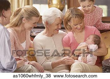 Stock Photo - grandmother smiling 
at her newborn 
grandchild with 
family around. 
fotosearch - search 
stock photos, 
pictures, images, 
and photo clipart