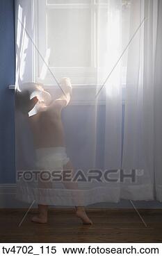 Stock Image - hispanic baby 
next to window. 
fotosearch - search 
stock photos, 
pictures, images, 
and photo clipart