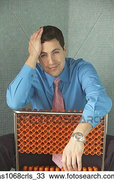 Stock Photo - hispanic businessman 
sitting backwards 
on a chair,  richmond. 
fotosearch - search 
stock photos, 
pictures, images, 
and photo clipart