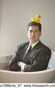 Picture - hispanic businessman 
sitting in a bathtub 
with a rubber 
ducky on his. 
fotosearch - search 
stock photos, 
pictures, images, 
and photo clipart