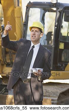 Stock Image - hispanic businessman 
wearing a hardhat 
standing in front 
of a. fotosearch 
- search stock 
photos, pictures, 
images, and photo 
clipart