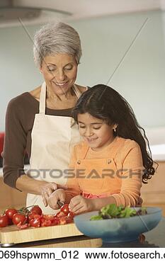 Stock Photo - hispanic grandmother 
and granddaughter 
making a salad, 
 richmond. fotosearch 
- search stock 
photos, pictures, 
images, and photo 
clipart