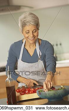 Stock Photography - hispanic grandmother 
making salad, 
richmond, virginia, 
united states. 
fotosearch - search 
stock photos, 
pictures, images, 
and photo clipart