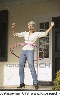 Stock Photo - hispanic grandmother 
playing with hula 
hoops on the porch, 
 richmond. fotosearch 
- search stock 
photos, pictures, 
images, and photo 
clipart