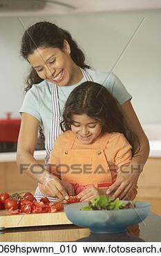 Stock Photography - hispanic mother 
and daughter making 
a salad,  richmond, 
 virginia. fotosearch 
- search stock 
photos, pictures, 
images, and photo 
clipart