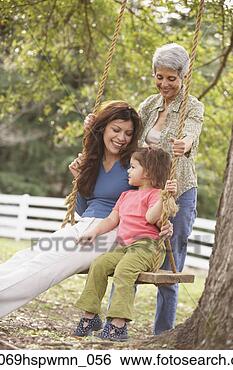 Stock Photo - hispanic mother 
and daughter sitting 
on a swing with 
grandmother. fotosearch 
- search stock 
photos, pictures, 
images, and photo 
clipart