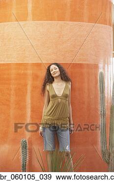 Stock Photograph - hispanic woman 
standing next 
to cactus, los 
cabos, mexico. 
fotosearch - search 
stock photos, 
pictures, images, 
and photo clipart
