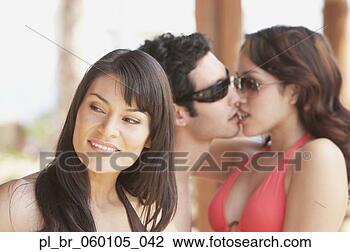Stock Photo - hispanic woman 
with young hispanic 
couple kissing 
in background, 
 los. fotosearch 
- search stock 
photos, pictures, 
images, and photo 
clipart