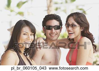 Stock Photo - hispanic woman 
and young hispanic 
couple smiling, 
los cabos, mexico. 
fotosearch - search 
stock photos, 
pictures, images, 
and photo clipart
