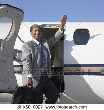Picture - indian businessman 
boarding airplane, 
perth, australia. 
fotosearch - search 
stock photos, 
pictures, images, 
and photo clipart