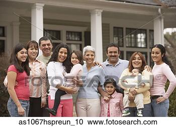 Stock Photography - large hispanic 
family standing 
in front of house, 
 richmond. fotosearch 
- search stock 
photos, pictures, 
images, and photo 
clipart