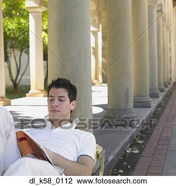 Stock Photo - male university 
student reading 
and listening 
to music,  perth. 
fotosearch - search 
stock photos, 
pictures, images, 
and photo clipart
