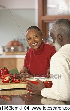 Stock Photo - senior african 
couple chopping 
vegetables,  richmond, 
 virginia. fotosearch 
- search stock 
photos, pictures, 
images, and photo 
clipart