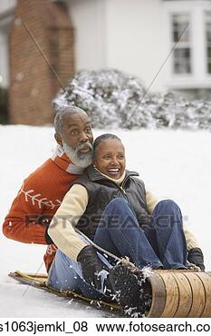 Stock Photo - senior african 
couple riding 
on a sled,  richmond, 
 virginia,  united. 
fotosearch - search 
stock photos, 
pictures, images, 
and photo clipart