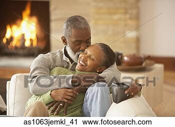 Stock Photography - senior african 
couple hugging 
on the sofa,  
richmond,  virginia. 
fotosearch - search 
stock photos, 
pictures, images, 
and photo clipart