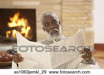 Stock Photograph - senior african 
man reading a 
newspaper,  richmond, 
 virginia,  united. 
fotosearch - search 
stock photos, 
pictures, images, 
and photo clipart