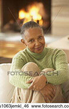 Stock Photo - senior african 
woman sitting 
on the sofa,  
richmond,  virginia. 
fotosearch - search 
stock photos, 
pictures, images, 
and photo clipart