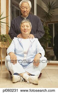 Stock Photography - senior asian man 
giving senior 
asian woman a 
neck massage, 
 san. fotosearch 
- search stock 
photos, pictures, 
images, and photo 
clipart