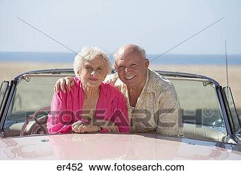 Stock Photo - senior couple 
in a pink convertible, 
las vegas, nevada, 
united states. 
fotosearch - search 
stock photos, 
pictures, images, 
and photo clipart