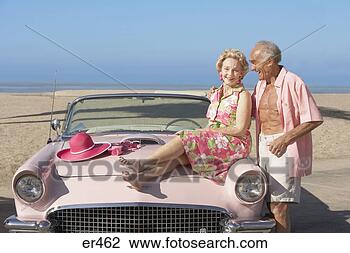Stock Photo - senior couple 
with pink convertible 
at the beach, 
 las vegas. fotosearch 
- search stock 
photos, pictures, 
images, and photo 
clipart